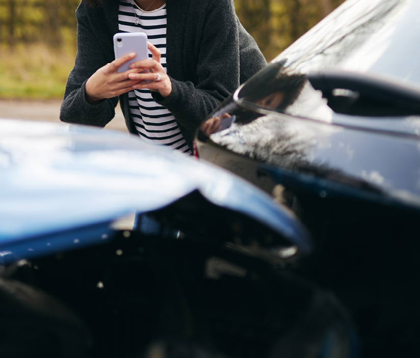 a_person_taking_pictures_of_accident_or_car_damage